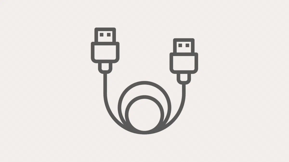 Cavi HDMI, DisplayPort e USB-C appoggiati accanto al retro di un monitor