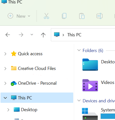 Barra laterale di Esplora file con la voce Creative Cloud Files sopra Questo PC e le unità disco